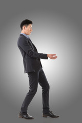 Holding pose of Asian business man