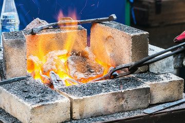 forge a burning forge and tools