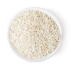 Bowl of white rice on white background, top view