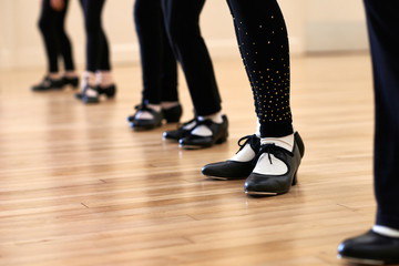 Fototapeta na wymiar Close Up Of Feet In Children's Tap Dancing Class