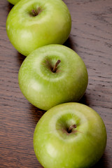 row of green apples