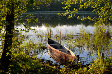 Fishing boat on the river at sunset