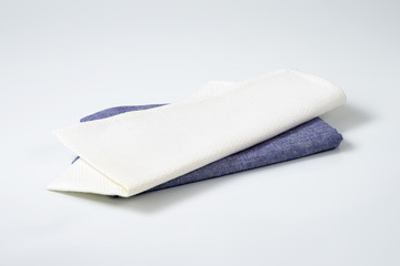 two folded napkins or place mats