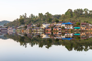 Fototapeta na wymiar Countryside village and mountain reflection in northern Thailand