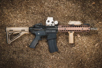 assault rifle on the forest ground