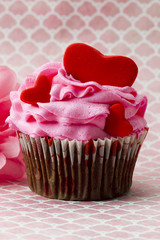 a cupcake with a heart in it.