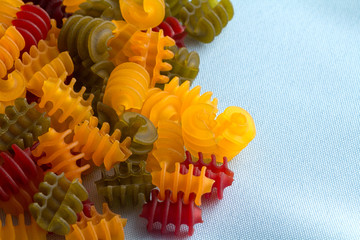 Corn vegetable radiatore pasta on a blue napkin