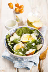 Spinach salad with hard boiled eggs and apple