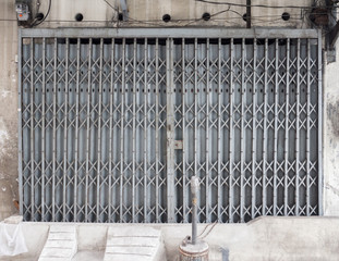 In front of store shop closed by shutter gate