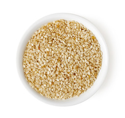 Bowl of flax seeds isolated on white, top view
