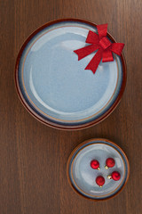 blue saucer and red ribbon