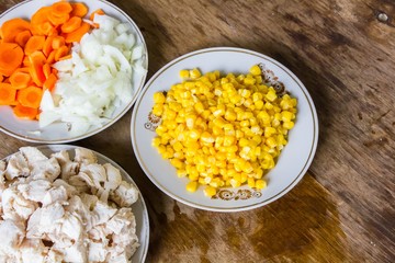 vegetables and boiled chicken fillet on the table