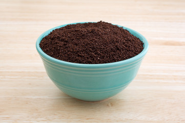 Kona coffee ground beans in a bowl