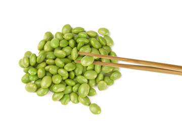soya bean being held by chopsticks