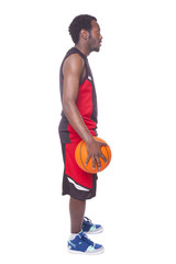 Fototapeta premium Side view of a African basketball player, isolated on white back