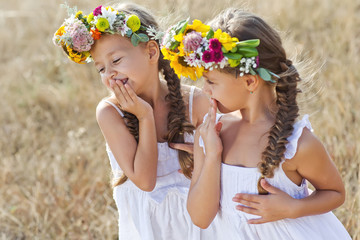 Kids with flower bunch on nature 