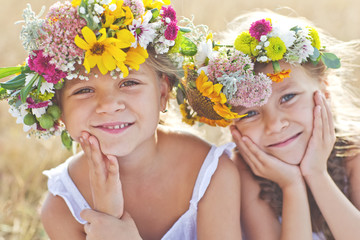 Kids with flower bunch on nature 