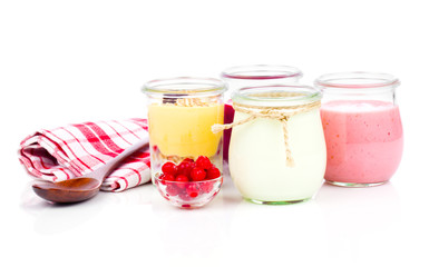 Delicious, nutritious and healthy yogurt in a glass jars with sp