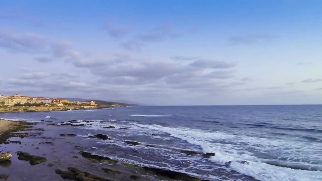 Evening view of rocky seacoast in Alghero city, Sardinia, Italy (Time Lapse)