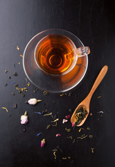 Cup of tea and assorted herbal tea with a spoon