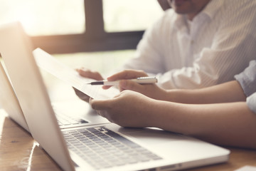 people working together with laptop computer