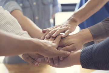 united hands for cooperation and teamwork concept