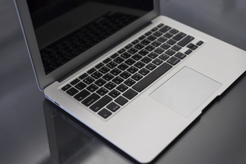 laptop computer on black table