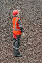 The woman in protective working clothes. labor protection