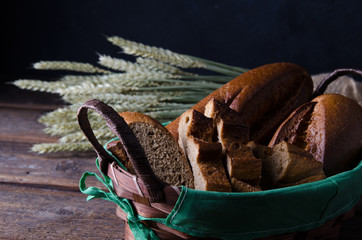 rye bread with wheat on a wooden table