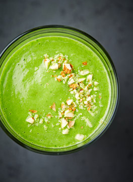 Organic spinach and almond milk smoothie with  almonds