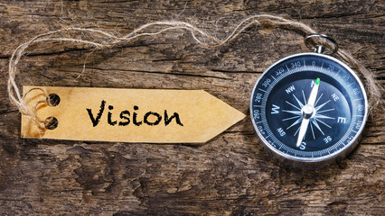 Vision word - Concept handwriting on label with compass