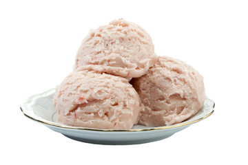 scoops of strawberry ice cream in plate
