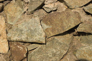 Background of stone boulders in the sunlight