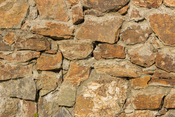 Background of stone boulders in the sunlight