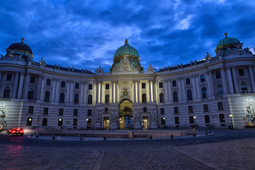Fototapeta na wymiar Hofburg Palace seen from Michaelerplatz, wide-angle view at dusk.Vienna.Austria.