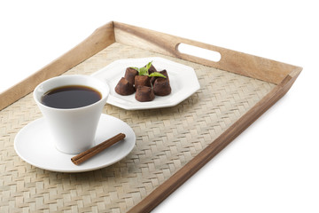 chocolate drink with chocolate truffles on the side