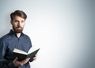 Bearded male with book