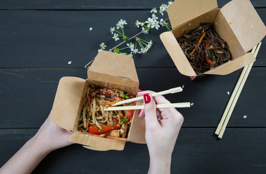 Girl Eating Noodles Out Of The Box