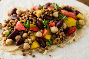 Vegan wraps with lentil, chickpea peppers and kidney bean