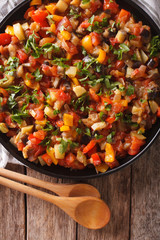 Spanish cuisine: vegetable stew Pisto manchego close-up. vertical top view
