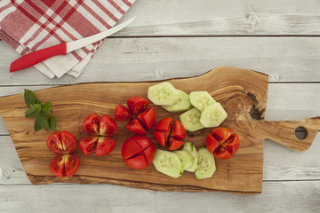Sliced tomatoes on chopping board