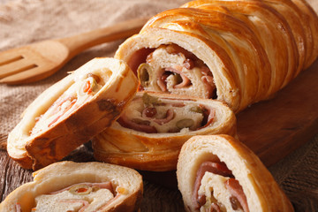 sliced bread stuffed with ham and olives macro. horizontal   © FomaA