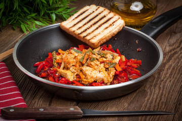 Fried chicken pieces with vegetables.