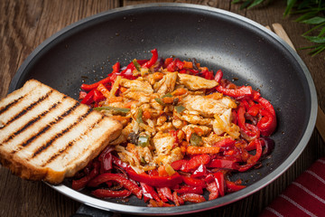 Fried chicken pieces with vegetables.