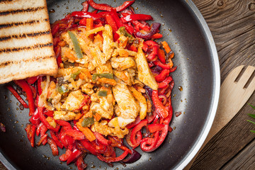 Fried chicken pieces with vegetables.