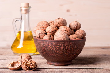 Walnuts and oil on the table