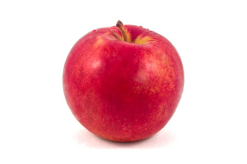 Wet red apple on a white background