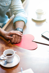 Cheerful young lovers are relaxing in restaurant