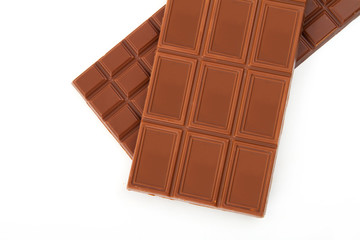different sorts of chocolate in a stack on white background