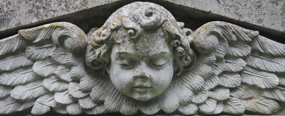 Vintage image of a sad angel on a cemetery